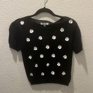 A cute black with leather flowers crop top